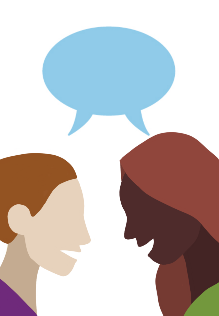 This image shows two women in a friendly conversation.